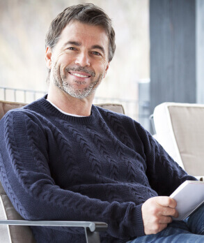 Smiling man in chair